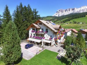 an aerial view of a house in the mountains at Apartments Lasteis in La Villa