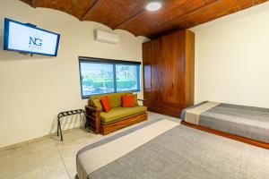 Postel nebo postele na pokoji v ubytování Hotel NG