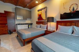 Postel nebo postele na pokoji v ubytování Hotel NG