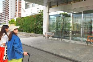 two women walking in front of a building at Bellevue Garden Hotel Kansai International Airport in Izumi-Sano