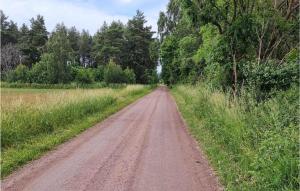 a dirt road in the middle of a field at 5 Bedroom Nice Home In Borgholm in Borgholm