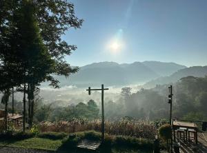 two crosses in front of a view of a valley at Camp Mai Mee Chue in Pong Yaeng