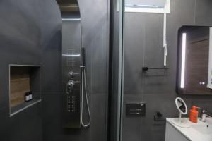 a bathroom with a shower and a sink at Vp & Lo 1 Residence in Corfu +20 photos