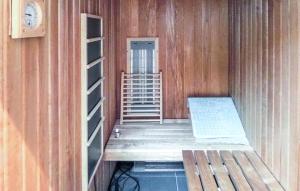 an empty room with stairs and a room with a door at Awesome Apartment In Bokn With Sauna in Kro