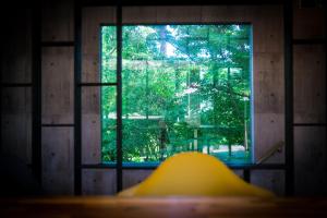 a view of a window in a room at Villa By Nature in Yawatano