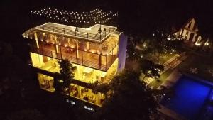 a large building with lights on it at night at Mantara in Matara