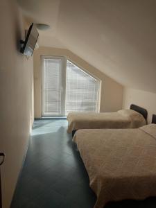 A bed or beds in a room at Family Hotel Maritime