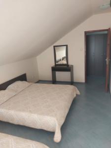 A bed or beds in a room at Family Hotel Maritime
