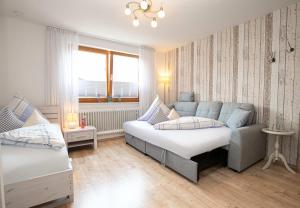 Postel nebo postele na pokoji v ubytování Hotel Restaurant Amadeus - inclusive Skipass und vieles mehr