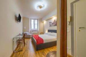 Postel nebo postele na pokoji v ubytování Home Boutique Santa Maria Novella