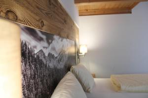 Postel nebo postele na pokoji v ubytování Hotel Rauscher - Das Naturteichparadies