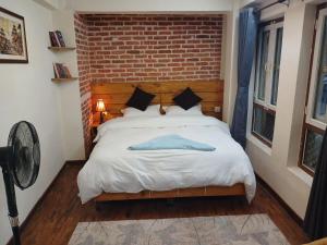 Voodi või voodid majutusasutuse Pilachhen Community Homestay Lacchi Photo Saino toas