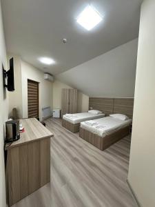 Voodi või voodid majutusasutuse Olive hotel toas