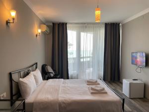 Postel nebo postele na pokoji v ubytování Argo Hotel