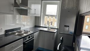 Kuchyň nebo kuchyňský kout v ubytování First Floor One Bed Apartment In Central West London + 11 fotografií