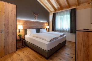 Postel nebo postele na pokoji v ubytování Pradas Resort Brigels