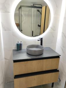 a bathroom with a sink and a mirror at ALEJANDRO PLAYA Gandia 1 in Los Mártires +14 photos