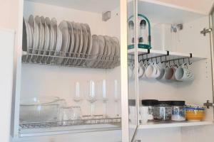 a kitchen with plates and utensils on a wall at Casa Olimpia 52 in Verona