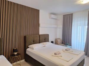 Ένα ή περισσότερα κρεβάτια σε δωμάτιο στο Apartment Slavica Novalja