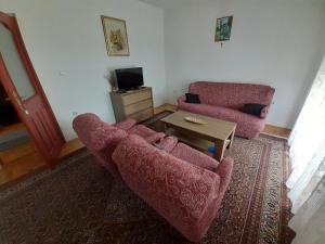 a living room with a couch and a chair at La Hacienda DD in Trebinje