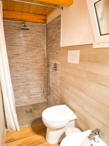 a bathroom with a toilet and a shower at Casa Azzurra - Casa dell'Ulivo in Triscina
