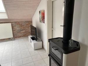 TV a/nebo společenská místnost v ubytování Appart' dans maison familiale