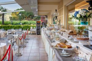 a buffet line with plates of food on display at Hotel Metropole in Santa Margherita Ligure