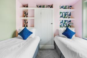 Voodi või voodid majutusasutuse Harbour House - Central Location with Free Parking toas