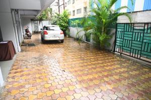 a car parked on a street with a colorful floor at Backpacker Hostel in Pune