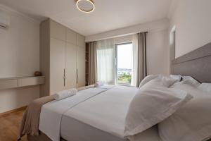 Postel nebo postele na pokoji v ubytování Rooms & Apartments Niko