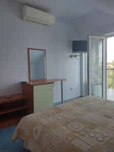 A bed or beds in a room at Family Hotel Maritime
