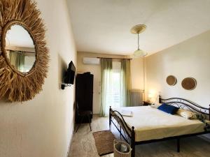 Postel nebo postele na pokoji v ubytování Aktaion Hotel