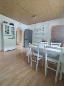 a kitchen and dining room with a table and chairs at Ferienwohnung Mila in Obernhof