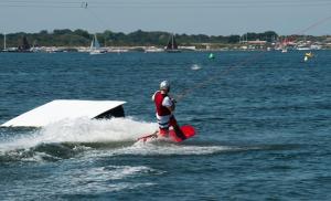 a man on a board in the water at van Harte in Zeeland in Kamperland