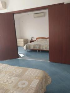 A bed or beds in a room at Family Hotel Maritime
