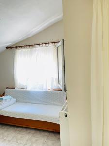 Postel nebo postele na pokoji v ubytování Aktaion Hotel