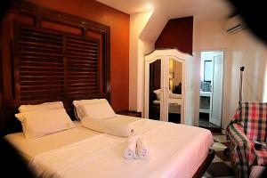 Postel nebo postele na pokoji v ubytování Green Monkey Resort Boracay