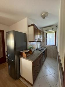 Kuchyňa alebo kuchynka v ubytovaní Apartment Tea Katnic + 21 fotografií