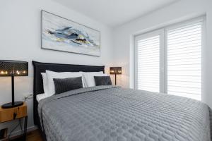 Ένα ή περισσότερα κρεβάτια σε δωμάτιο στο Luxury Apartment - PERLIUKAS