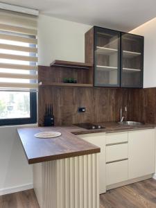 a kitchen with white cabinets and a counter top at Casa Nita in Ulcinj +75 photos