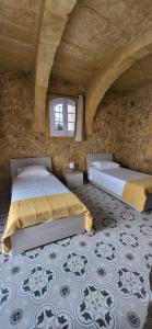 Postel nebo postele na pokoji v ubytování Tan-Napli Farmhouse