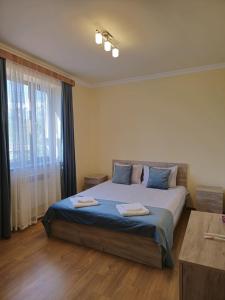 Ein Bett oder Betten in einem Zimmer der Unterkunft Zartonq