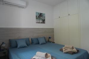 Ένα ή περισσότερα κρεβάτια σε δωμάτιο στο Skeleas Apartments +41 φωτογραφίες