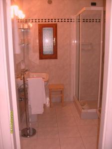 a bathroom with a shower and a toilet and a sink at La Fattoressa in Florence +55 photos