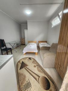 Postel nebo postele na pokoji v ubytování Apartments On Vaja Pshavela