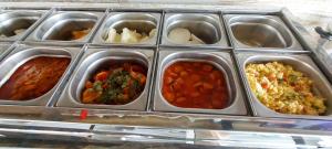 a plastic container filled with different types of food at Pousada Rota do Pilão in Araçoiaba