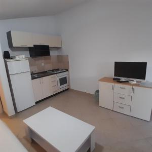 Kuchyň nebo kuchyňský kout v ubytování Apartments Jurjevic