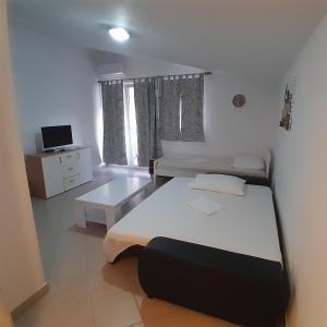 Postel nebo postele na pokoji v ubytování Apartments Jurjevic