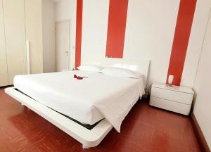 Voodi või voodid majutusasutuse Alghe Rosse Relax toas