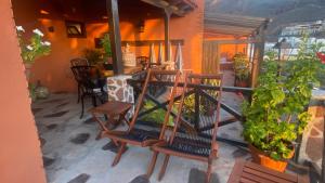 a balcony with two chairs and a table and a table at Casa Moni con Vistas al Mar in Playa de Santiago